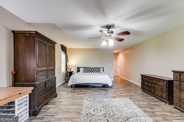 bedroom featuring ceiling fan and light wood-type flooring