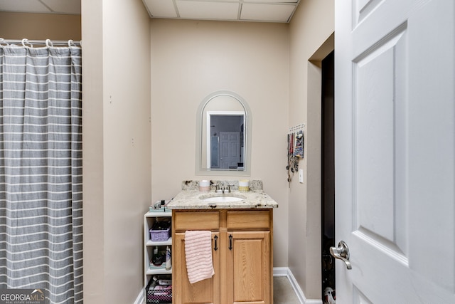 bathroom featuring vanity and a paneled ceiling