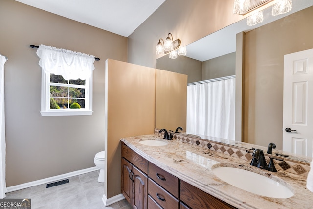 bathroom with vanity and toilet