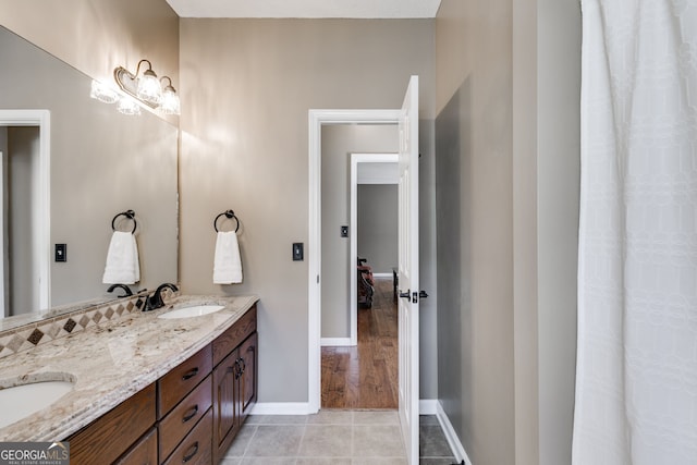 bathroom featuring tile patterned flooring and vanity