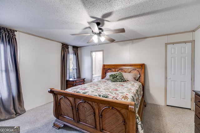 carpeted bedroom featuring ceiling fan, ornamental molding, and a textured ceiling