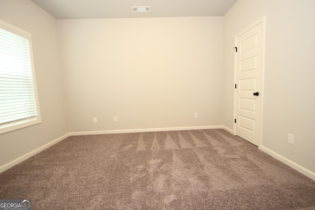 empty room with carpet flooring