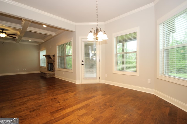 interior space featuring coffered ceiling, a healthy amount of sunlight, a stone fireplace, and dark hardwood / wood-style flooring