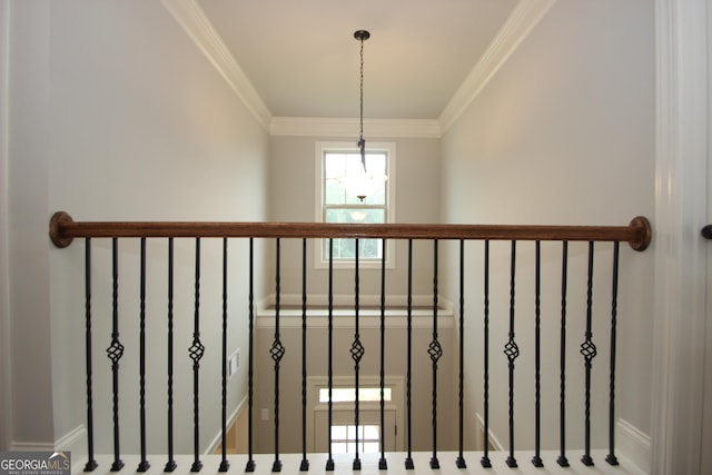 stairs featuring crown molding