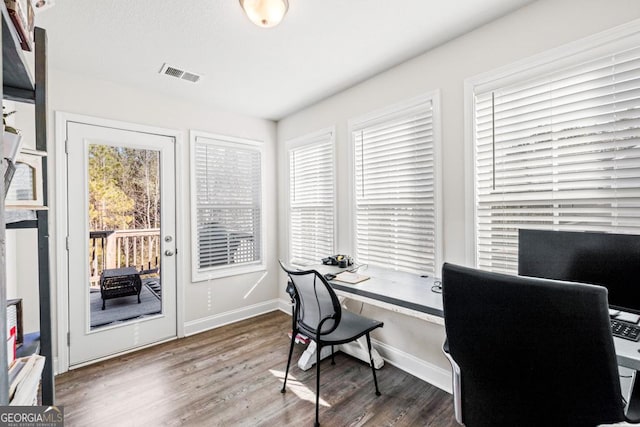 office space with dark hardwood / wood-style flooring