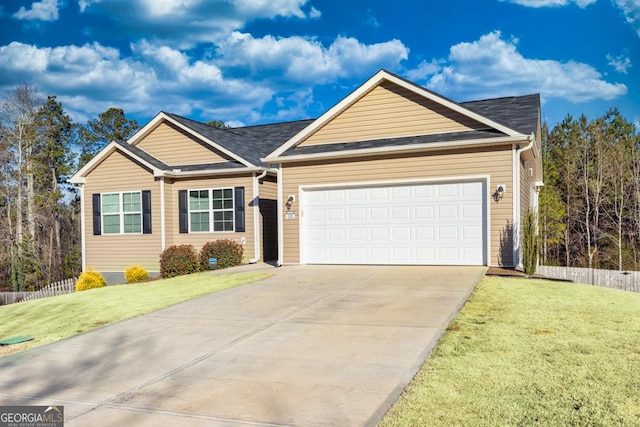 single story home with a garage and a front lawn