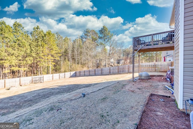 view of yard with a wooden deck