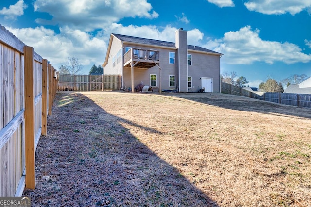 back of house with a lawn