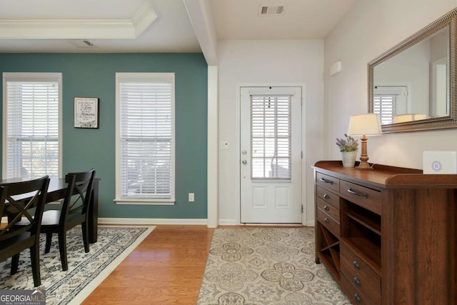 entryway with light hardwood / wood-style floors