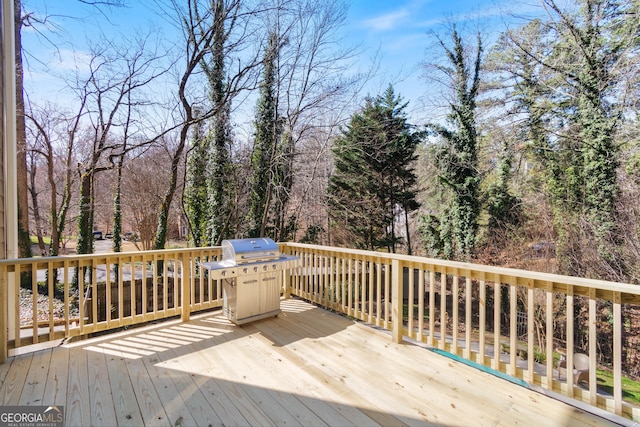 wooden terrace featuring area for grilling