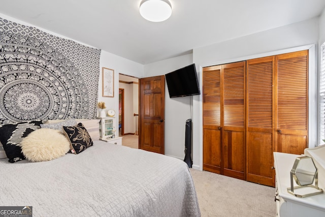 carpeted bedroom with a closet