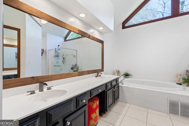 bathroom with separate shower and tub, vanity, and tile patterned flooring