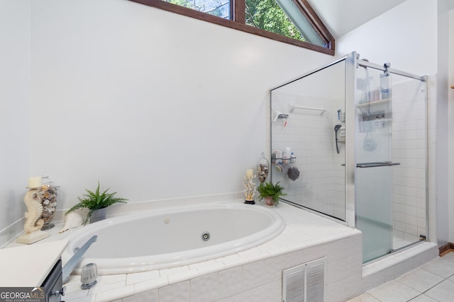 bathroom featuring tile patterned floors, vaulted ceiling, and plus walk in shower