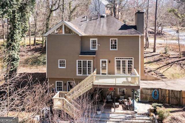 rear view of property with a patio and a deck