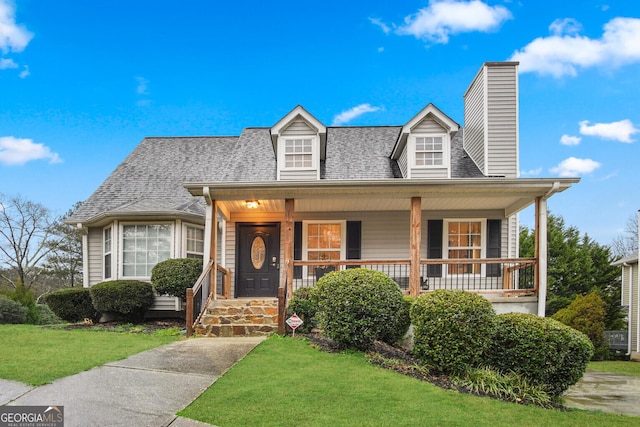 view of front of house with a front lawn and a porch