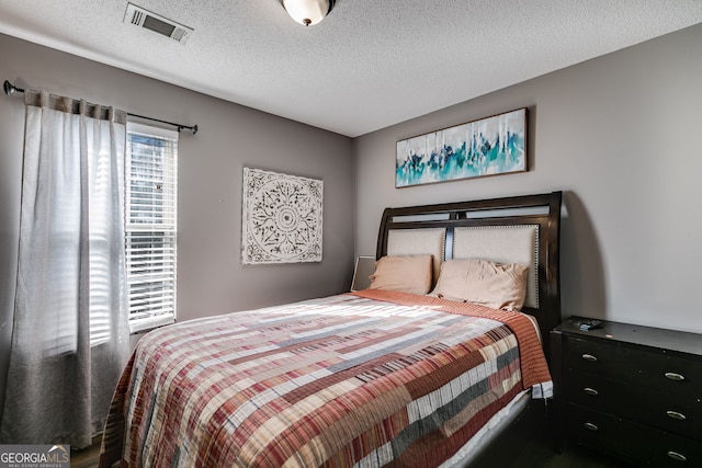 bedroom with a textured ceiling