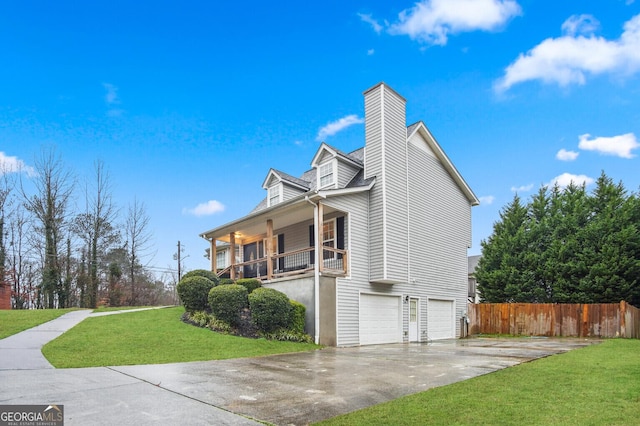 view of home's exterior featuring a porch, a garage, and a yard