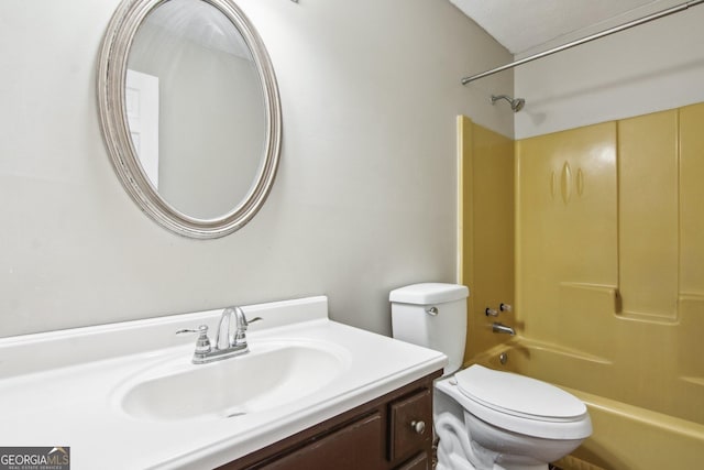 bathroom with tub / shower combination, vanity, and toilet