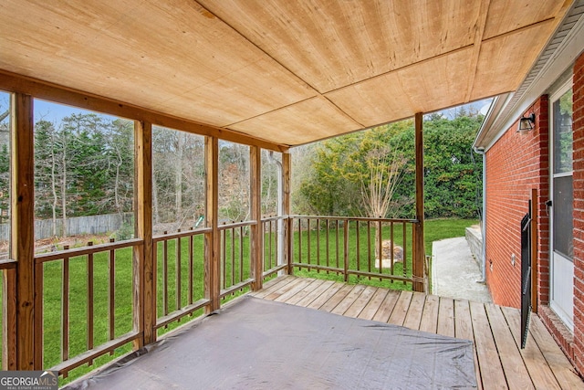 unfurnished sunroom with wood ceiling