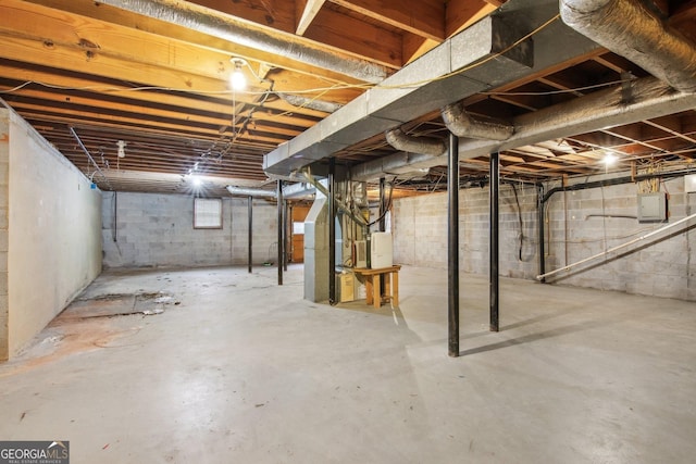 unfinished basement featuring electric panel