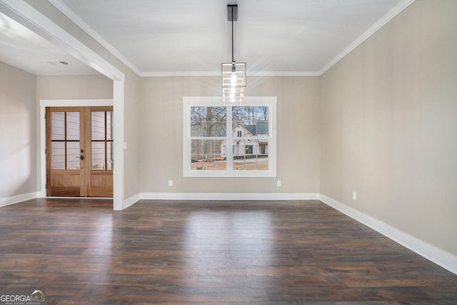 unfurnished dining area featuring ornamental molding, dark hardwood / wood-style floors, and french doors