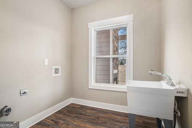 laundry room with washer hookup, sink, and dark hardwood / wood-style floors