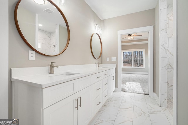 bathroom featuring ceiling fan and vanity