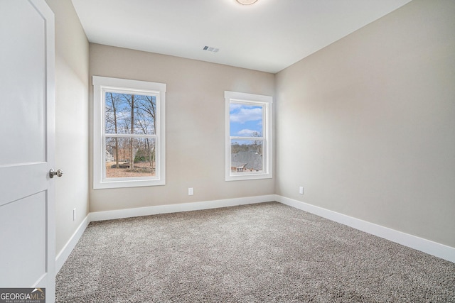 empty room with carpet flooring