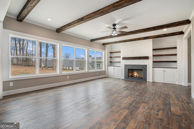 unfurnished living room with dark wood-type flooring, ceiling fan, and beam ceiling