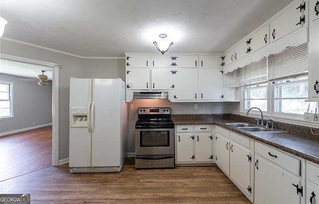 kitchen featuring sink, white cabinetry, range hood, white fridge with ice dispenser, and stainless steel range with electric cooktop