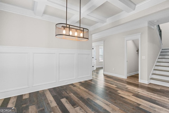 unfurnished dining area with coffered ceiling, dark hardwood / wood-style floors, a notable chandelier, and beam ceiling