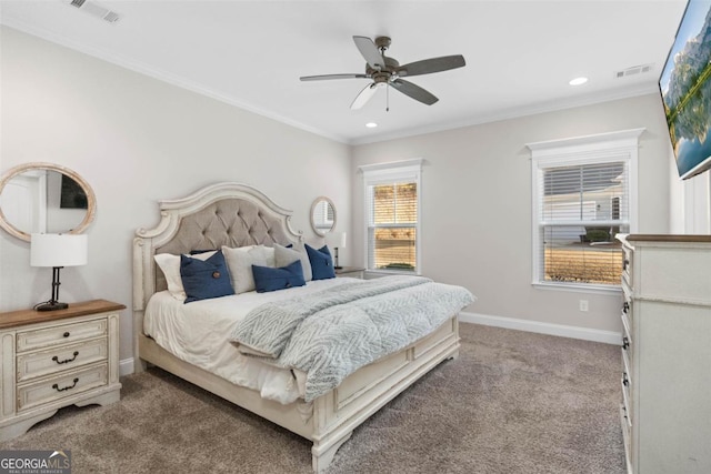 bedroom featuring crown molding, light colored carpet, and ceiling fan