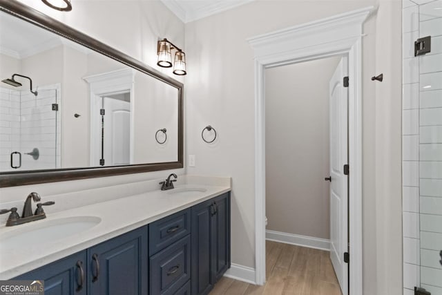 bathroom featuring crown molding, a shower with door, vanity, wood-type flooring, and toilet