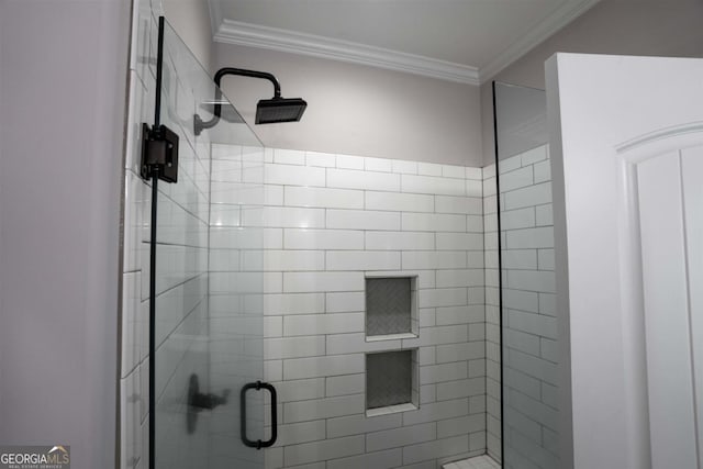 bathroom with crown molding and walk in shower