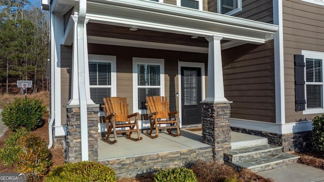 view of exterior entry with a porch