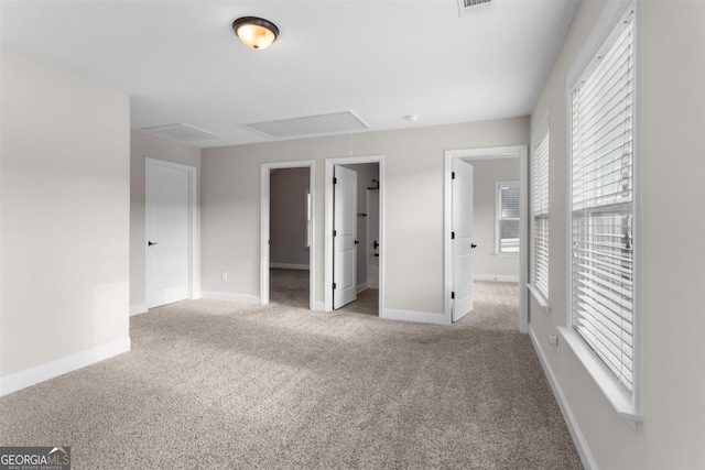 unfurnished bedroom featuring carpet floors and a spacious closet