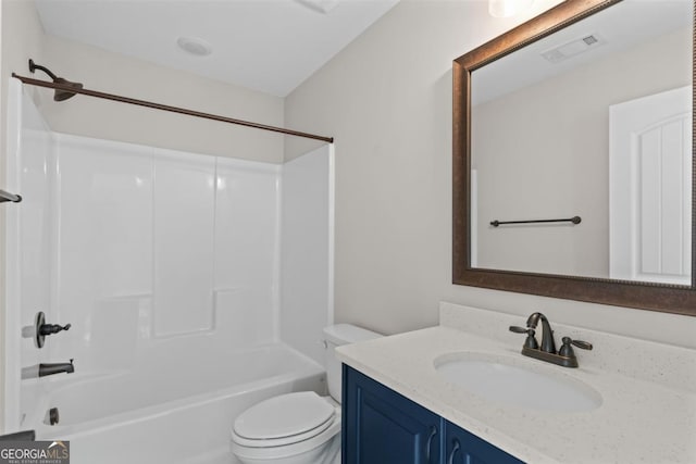 full bathroom with bathtub / shower combination, vanity, and toilet