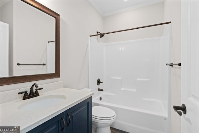 full bathroom featuring ornamental molding, vanity, shower / bathtub combination, and toilet