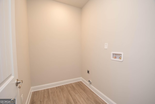 laundry area with hookup for a washing machine, electric dryer hookup, and light wood-type flooring