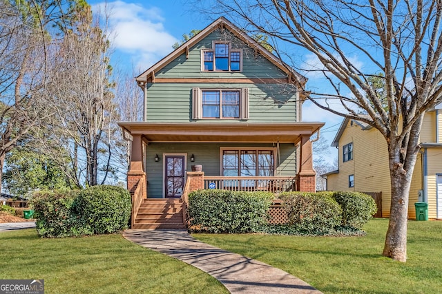 view of front of home with covered porch and a front yard