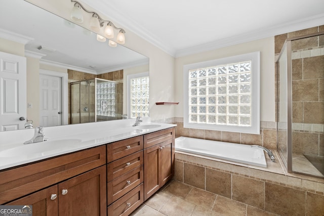 full bathroom featuring a garden tub, a shower stall, ornamental molding, and a sink