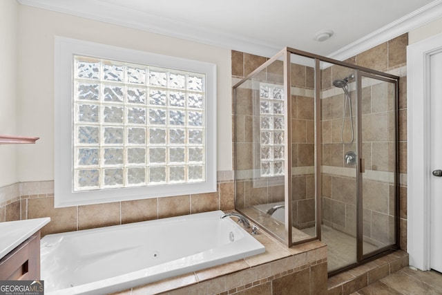 full bath with a bath, ornamental molding, a shower stall, and vanity