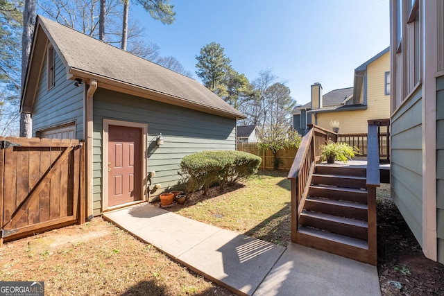 exterior space featuring stairs and fence