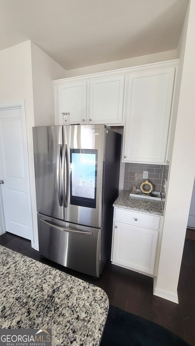 7157 Gladstone, Stonecrest, GA 30038 - kitchen with smart refrigerator, white cabinetry, backsplash, light stone counters, and dark wood finished floors