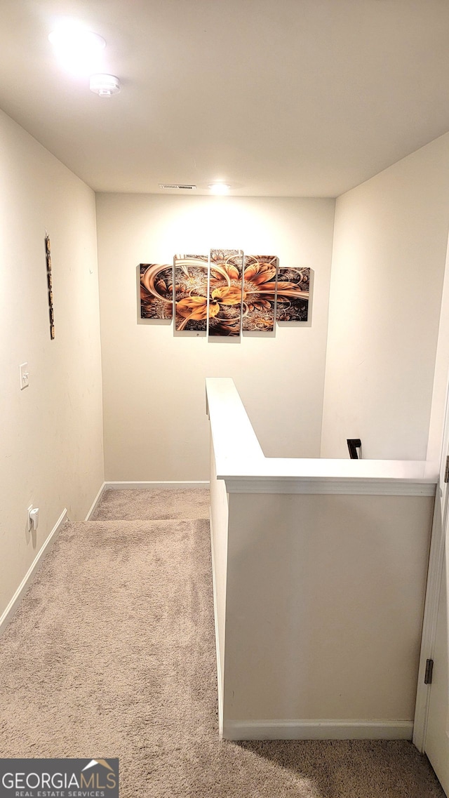 7157 Gladstone, Stonecrest, GA 30038 - hallway featuring carpet, baseboards, visible vents, and an upstairs landing
