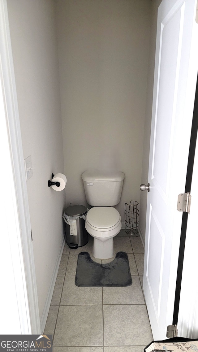 7157 Gladstone, Stonecrest, GA 30038 - bathroom with toilet, baseboards, and tile patterned floors