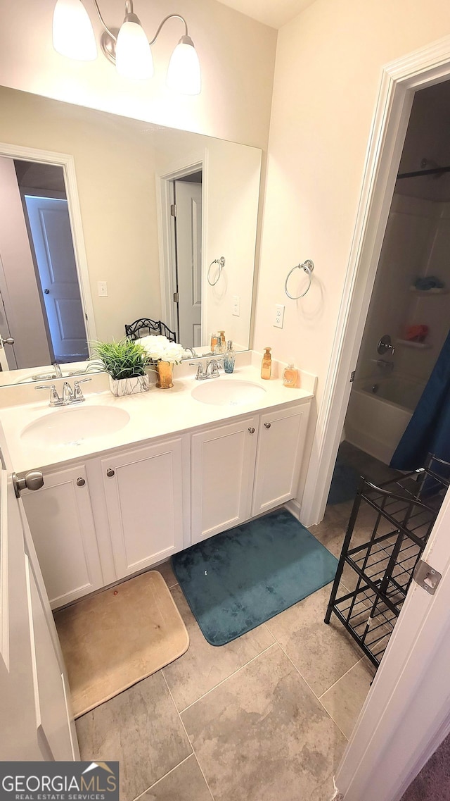 7157 Gladstone, Stonecrest, GA 30038 - full bathroom featuring double vanity, a sink, and shower / bathing tub combination
