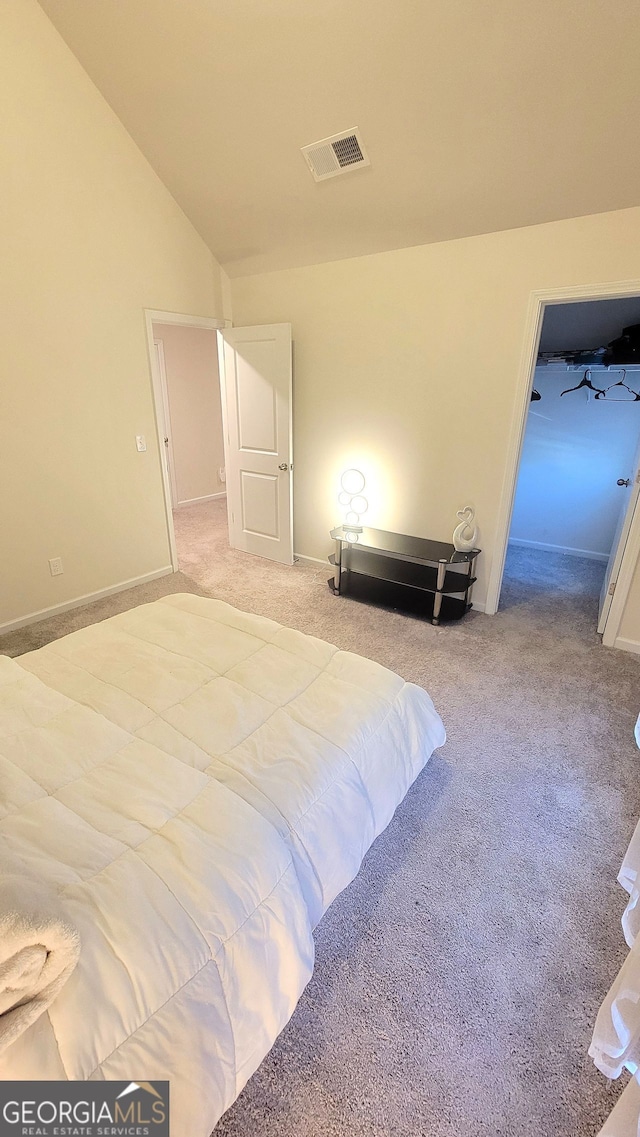 7157 Gladstone, Stonecrest, GA 30038 - unfurnished bedroom featuring visible vents, vaulted ceiling, and carpet flooring