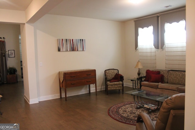 sitting room with dark hardwood / wood-style flooring