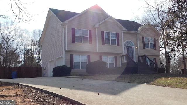 bi-level home featuring a garage